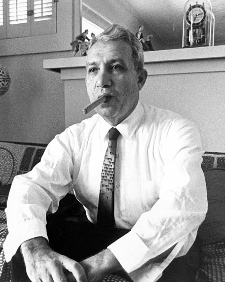 Clyde Smaldone relaxes and smokes a cigar in his home in the early 1960s.