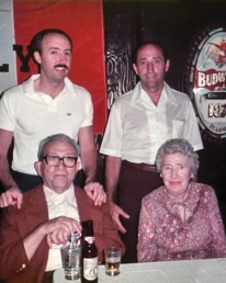 An elderly Clyde and Mildred Smaldone pose with their sons Gene (top left) and Chuck (top right).