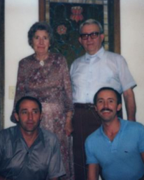 An elderly Clyde and Mildred Smaldone pose with their sons Gene (bottom left) and Chuck (bottom right).