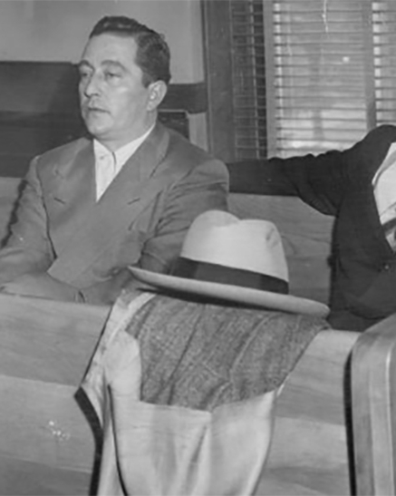 Paul (The Harp) Enrichi (left) and Eugene (Checkers) Smaldone sit quietly in district court in 1953 after pleading innocent to charges stemming from a gambling raid.