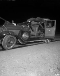 The remains of the vehicle of Leo Barnes, allegedly targeted for assassination by Clyde Smaldone, Checkers Smaldone, and Smiling Charlie Stephens. The trio were sent to prison in the mid-1930's.