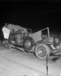 The remains of the vehicle of Leo Barnes, allegedly targeted for assassination by Clyde Smaldone, Checkers Smaldone, and Smiling Charlie Stephens. The trio were sent to prison in the mid-1930's.
